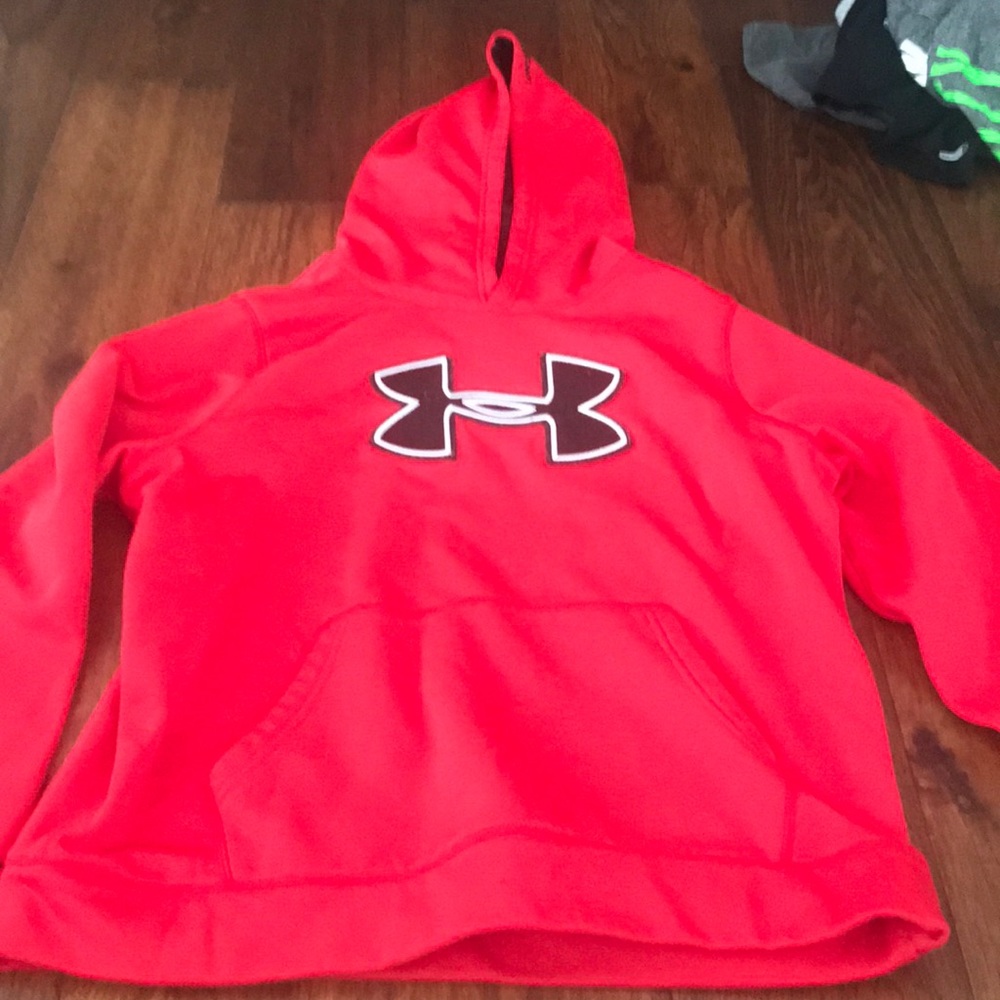Under Armour pull over with a few pulled places